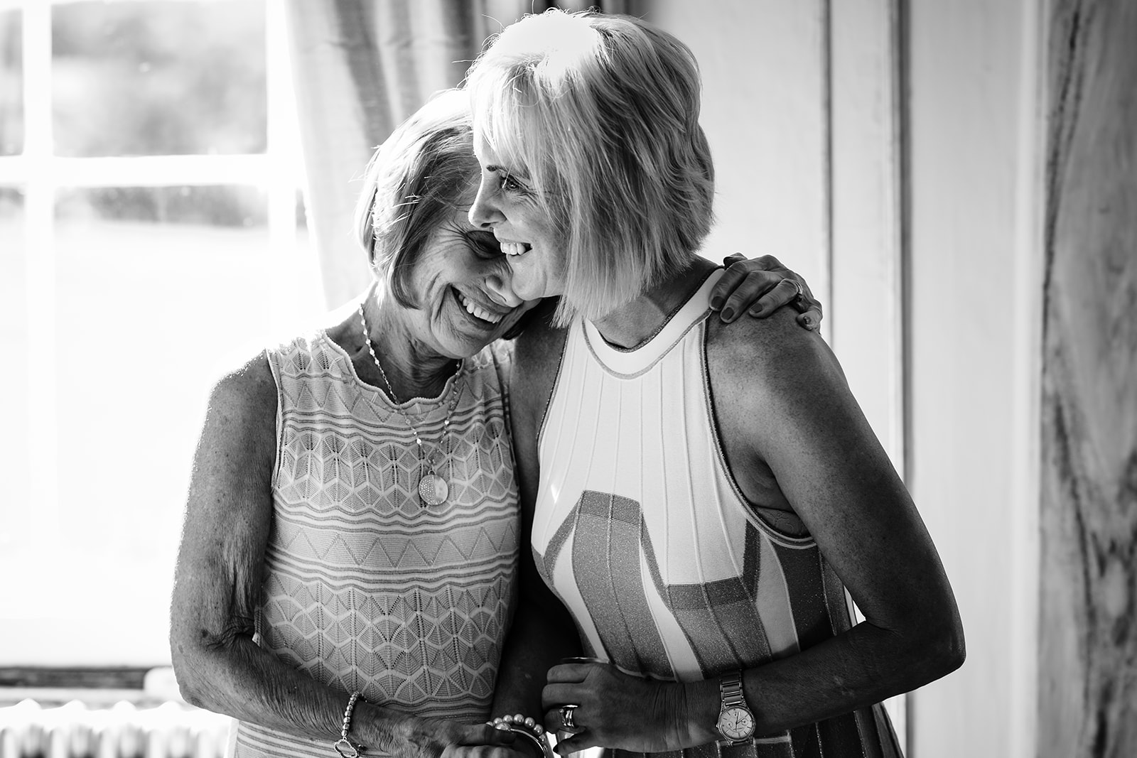 Mother of the bride and nan sharing an emotional moment