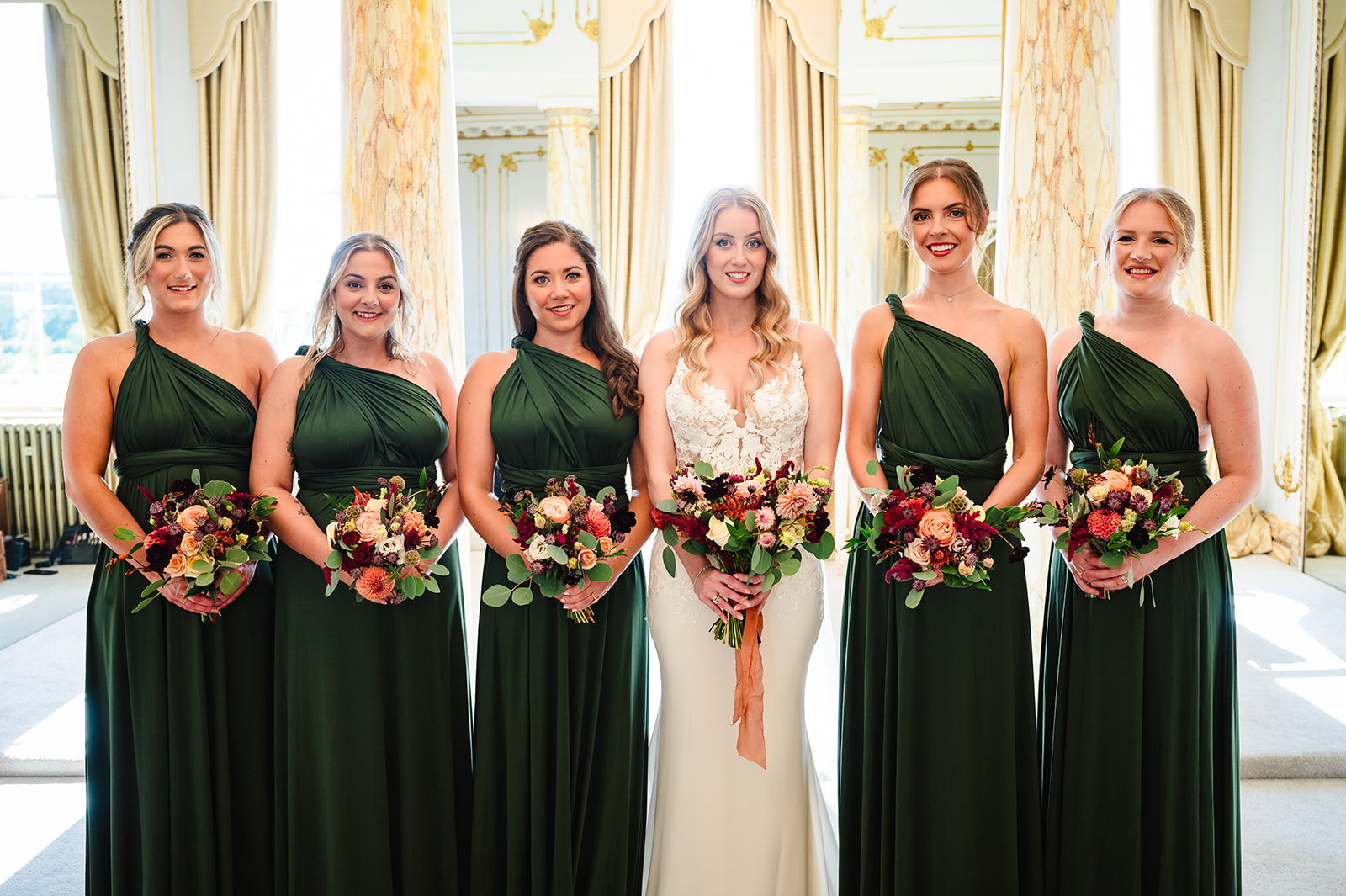 Bride and her bridesmaids in the rococo suite at gosfield hall 