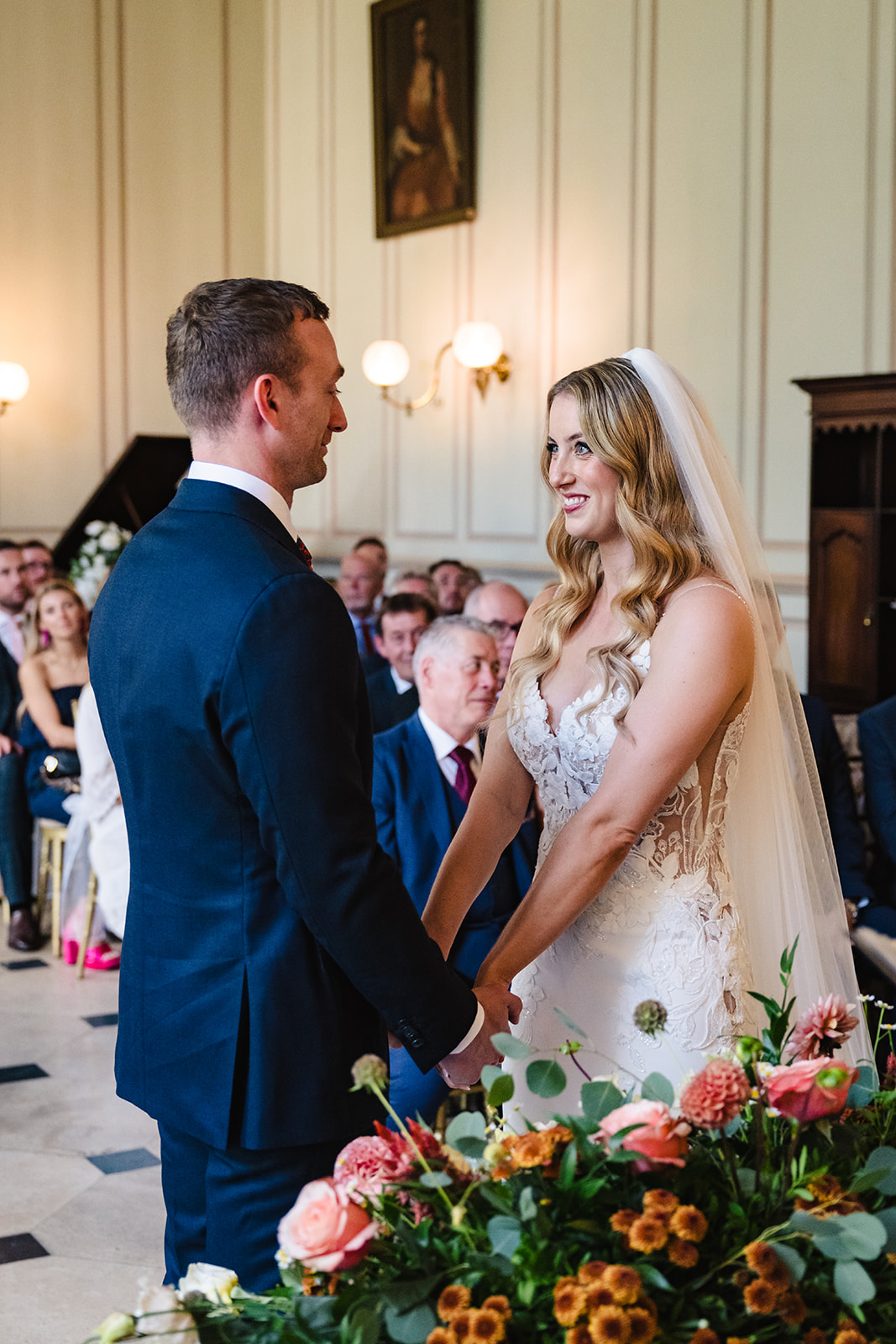 Bride and groom exchanging vows in gosfield halls grand salon