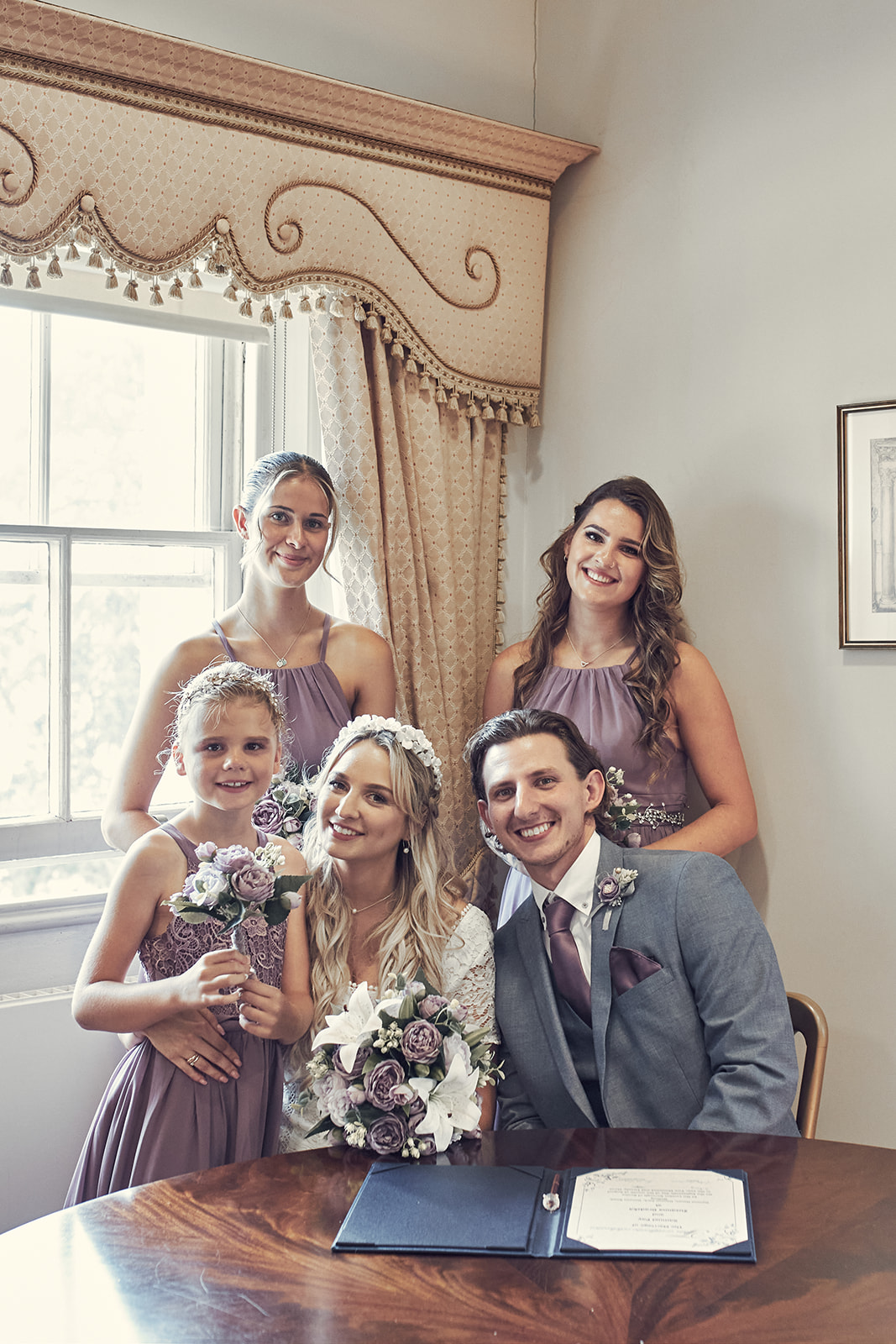 bride and groom with bridesmaids 