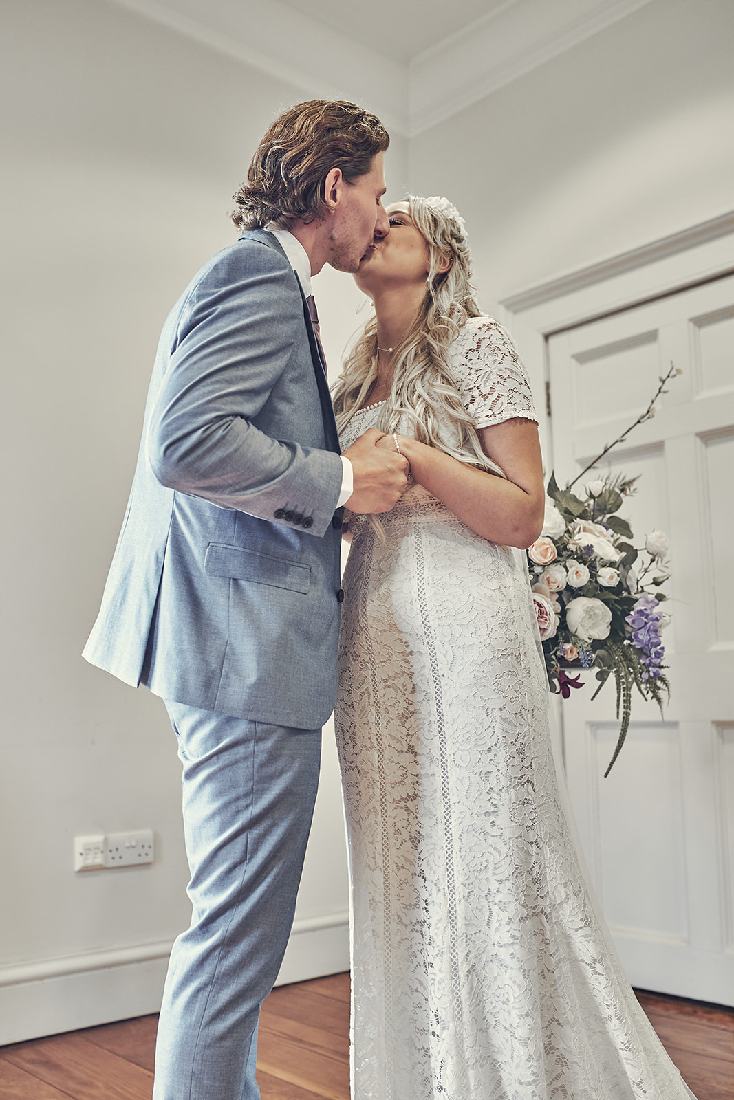 bride and groom kiss at Danson house