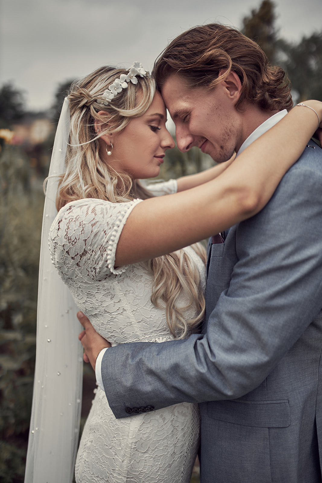 bride and groom leaning foreheads