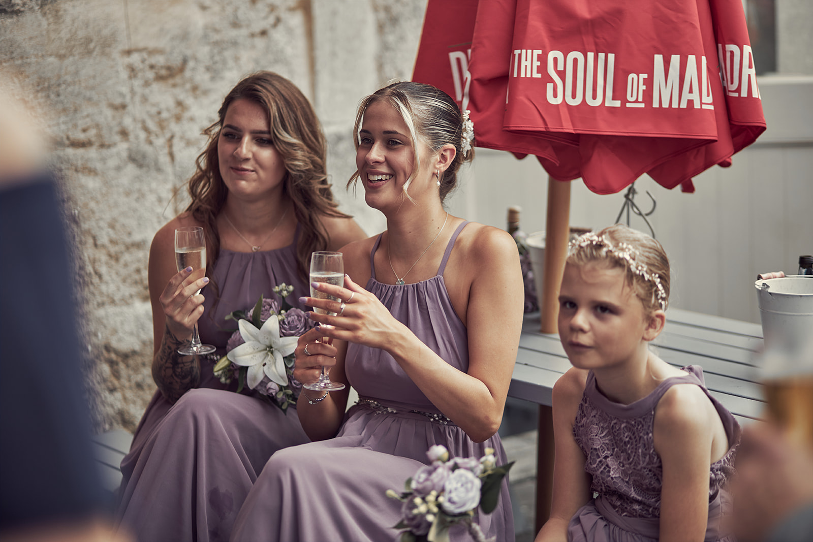 bridesmaids holding glass of wine