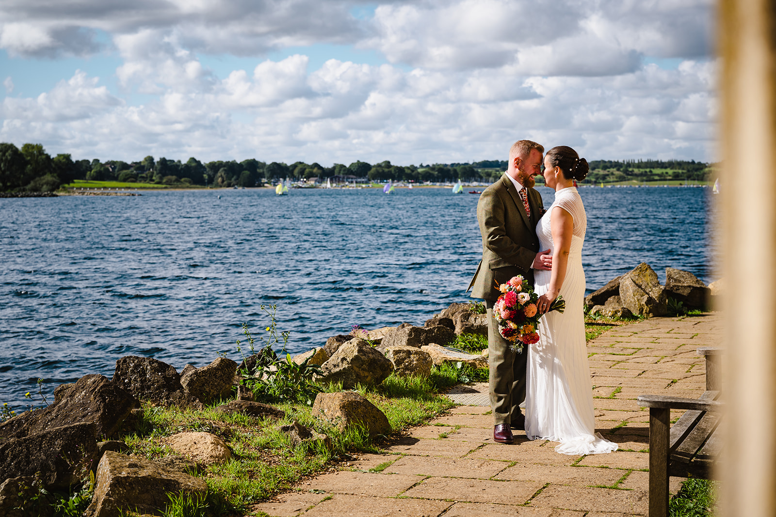 bride and groom posing for a portrait at rutland water