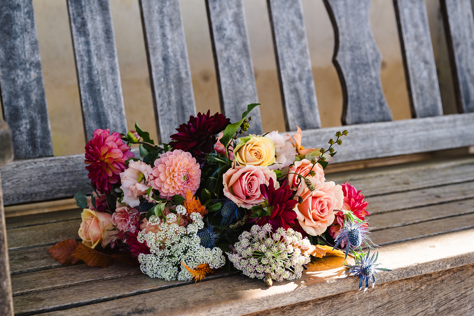 colourful wedding bouquet on bench at normanton church