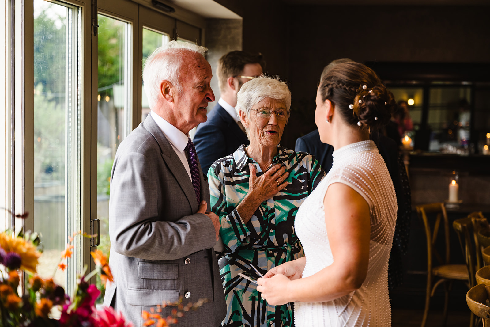 wedding guests chatting at wedding reception at the finches arms hambleton