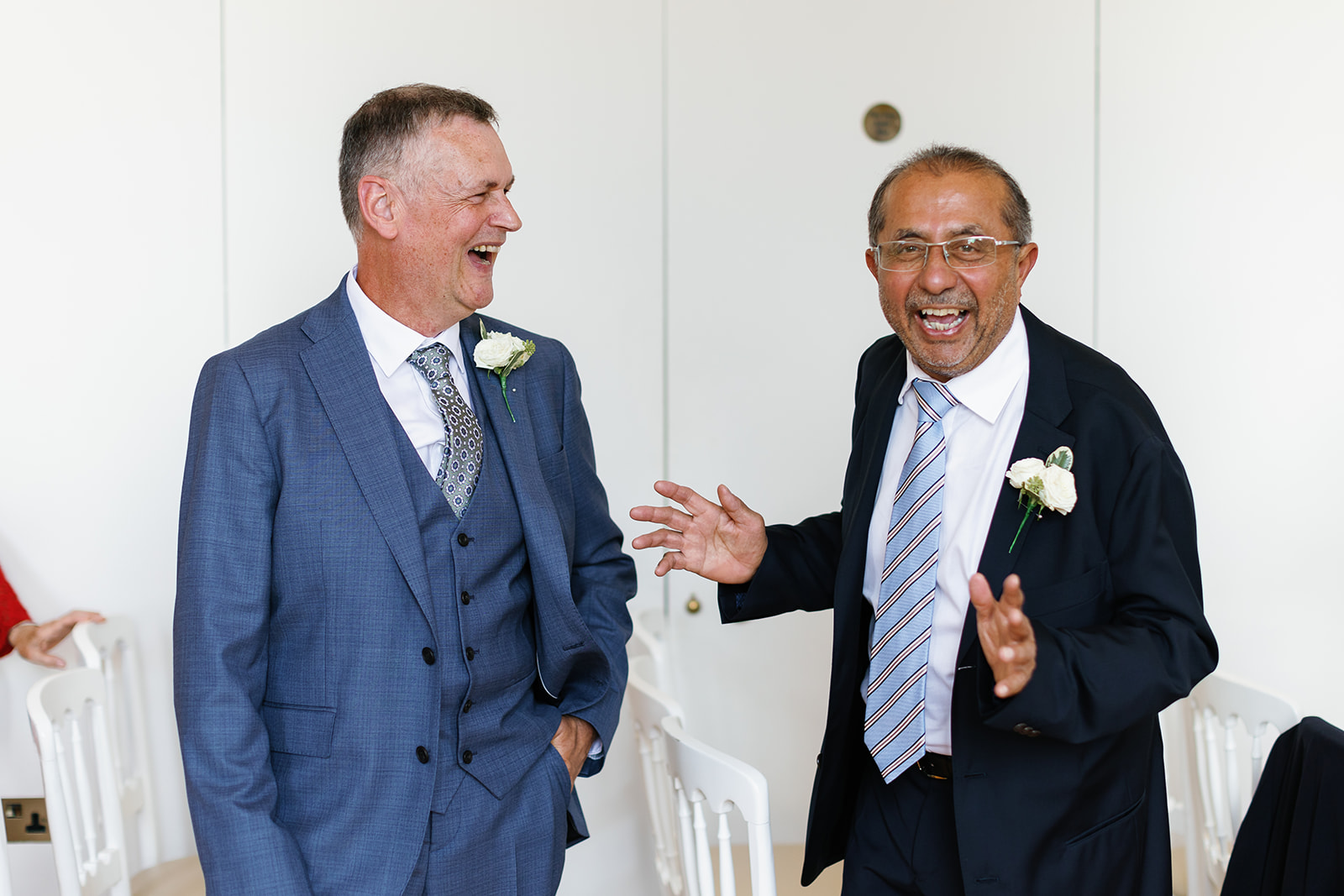 bride and groom fathers laughing