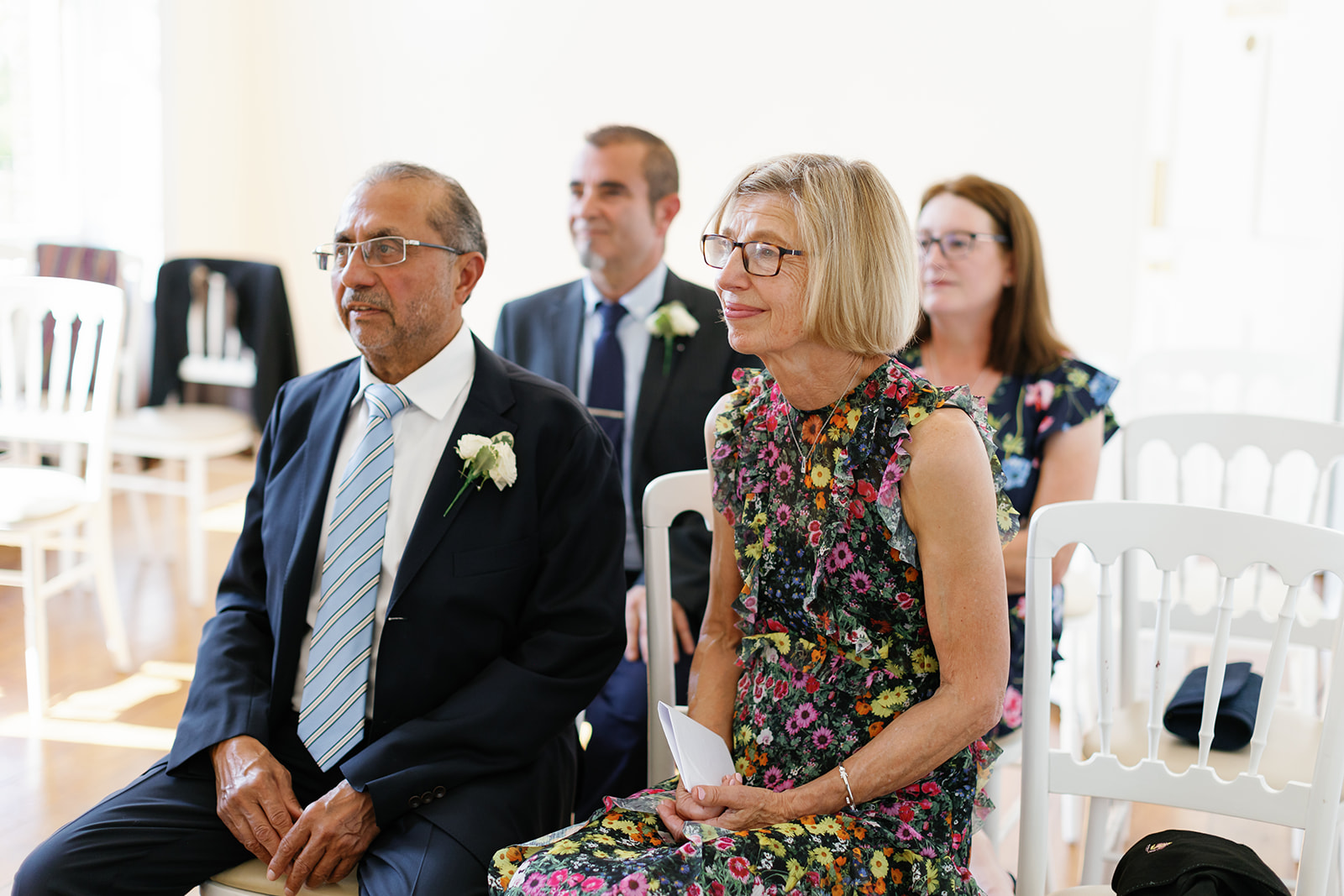 bride's parents looking emotional