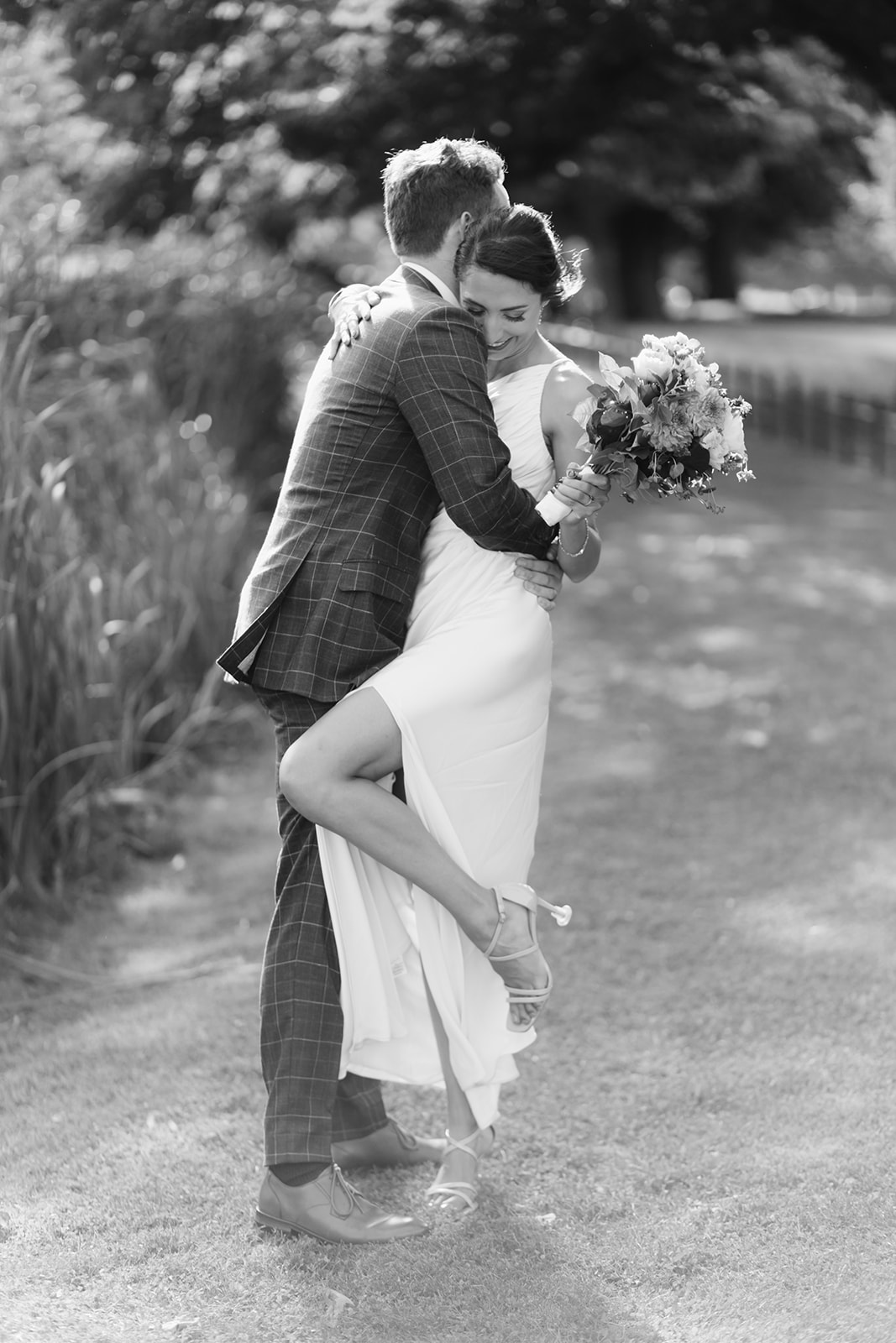 portrait of bride and groom embracing