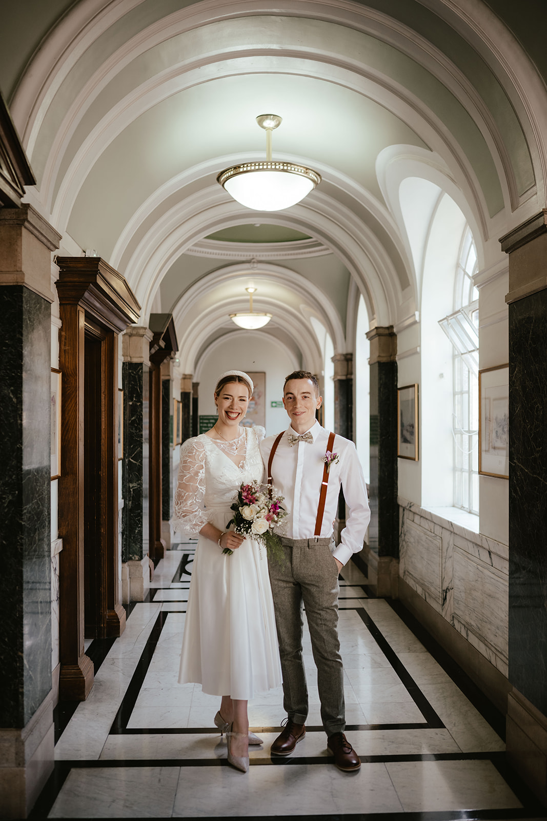 Beautiful portrait of Alex and Christina in the hallway at Islington Town Hall
