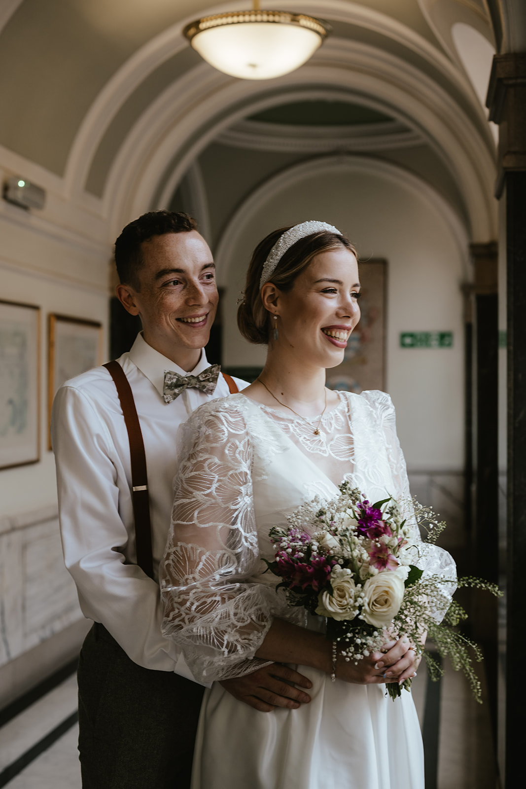 Romantic candid portrait of Alex and Christina in the hallway at Islington Town Hall