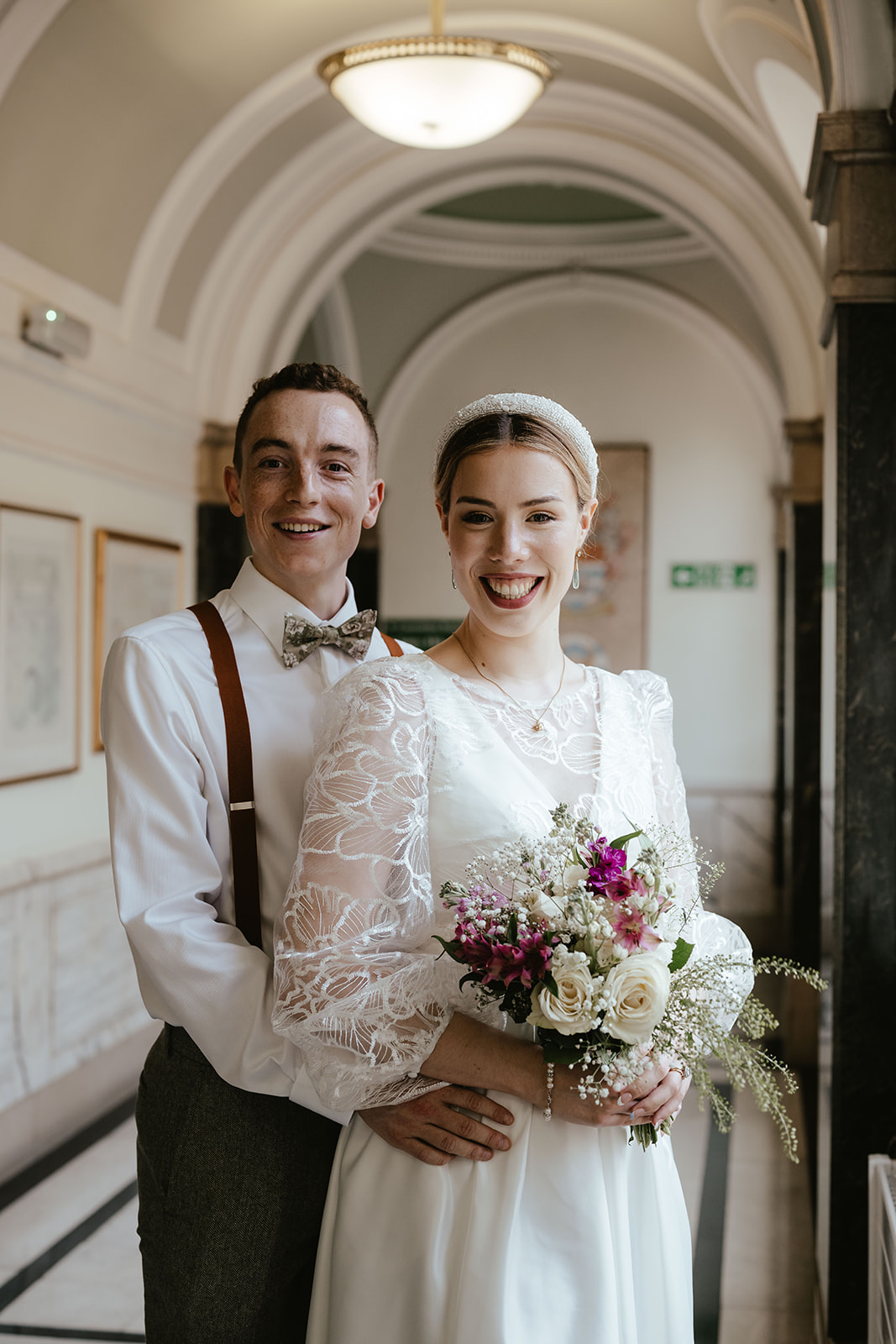 Romantic portrait of Alex and Christina in the hallway at Islington Town Hall