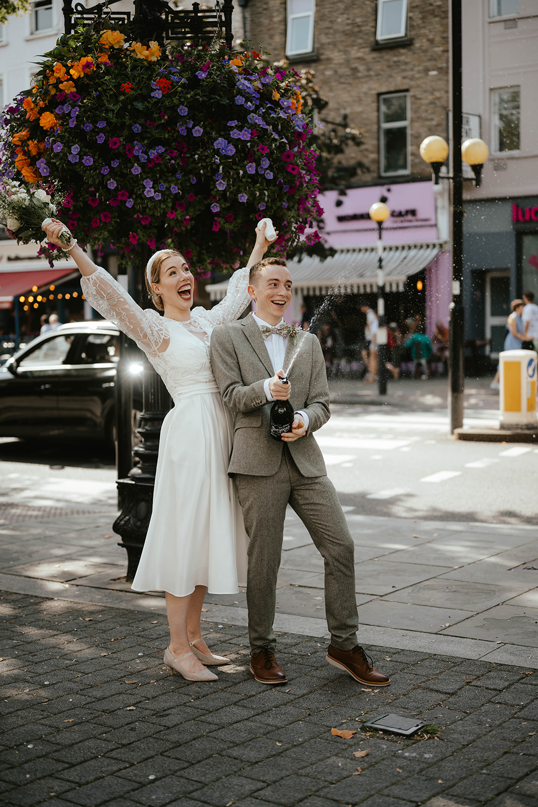 Stunning portrait of Alex and Christina with champagne in the streets of London