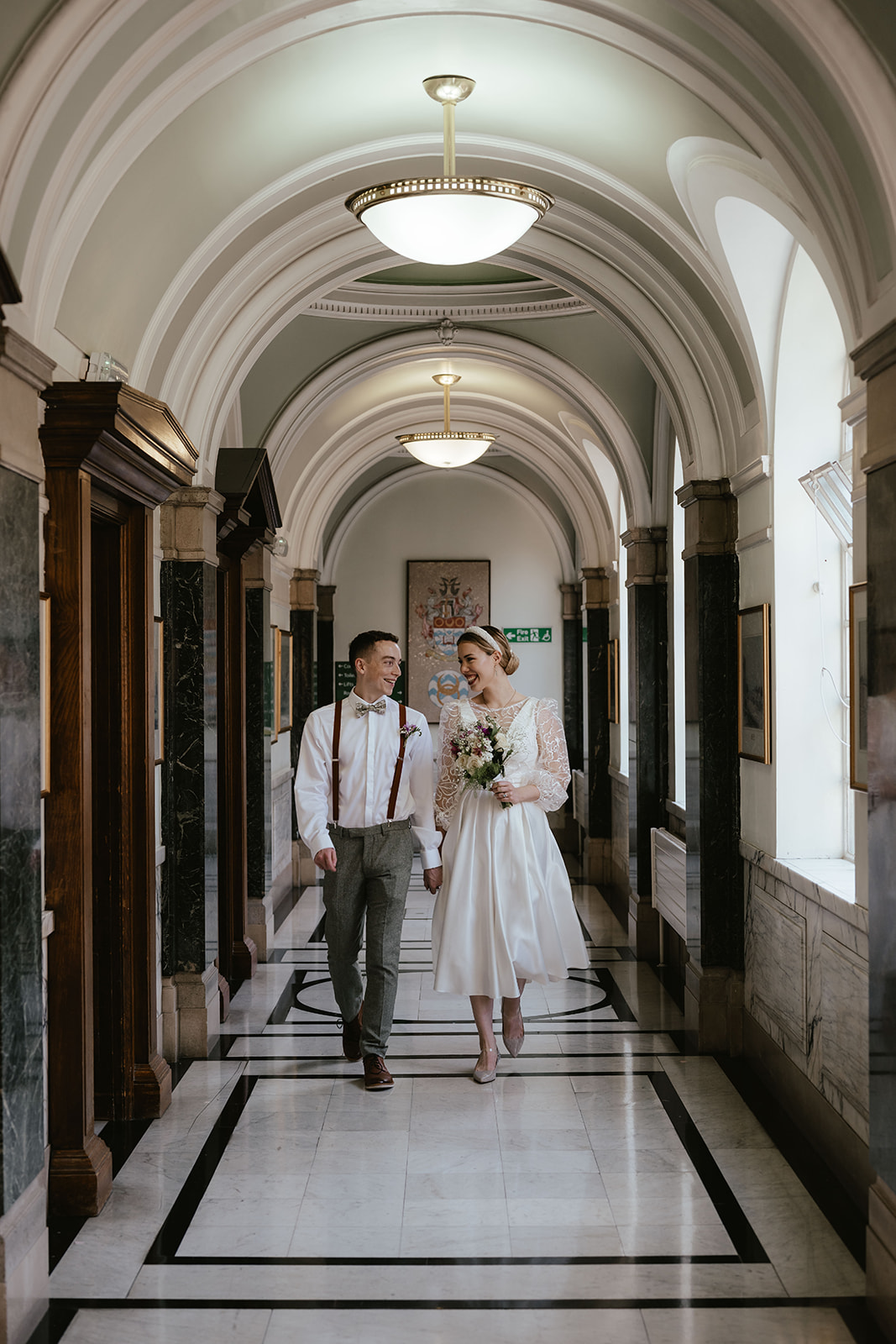 Sweet portrait of Alex and Christina in the hallway at Islington Town Hall