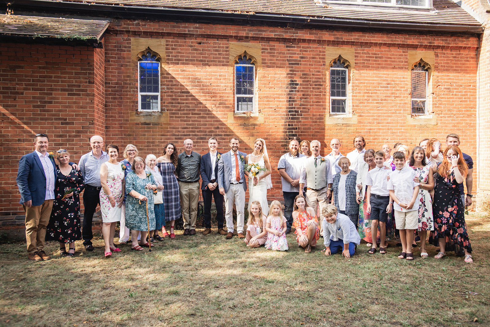 Beautiful portrait of Natalie and George with the family at Ashburton Hall