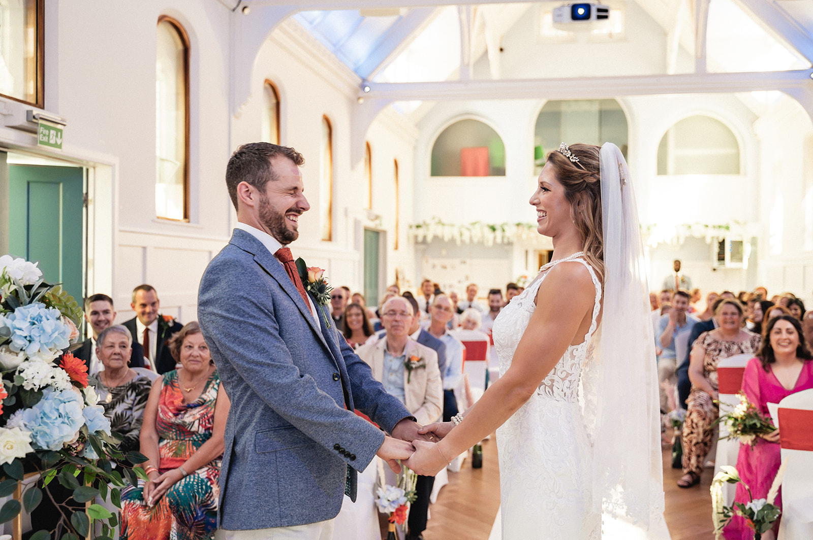 Natalie and George exchanging vows during the wedding ceremony at Ashburton Hall
