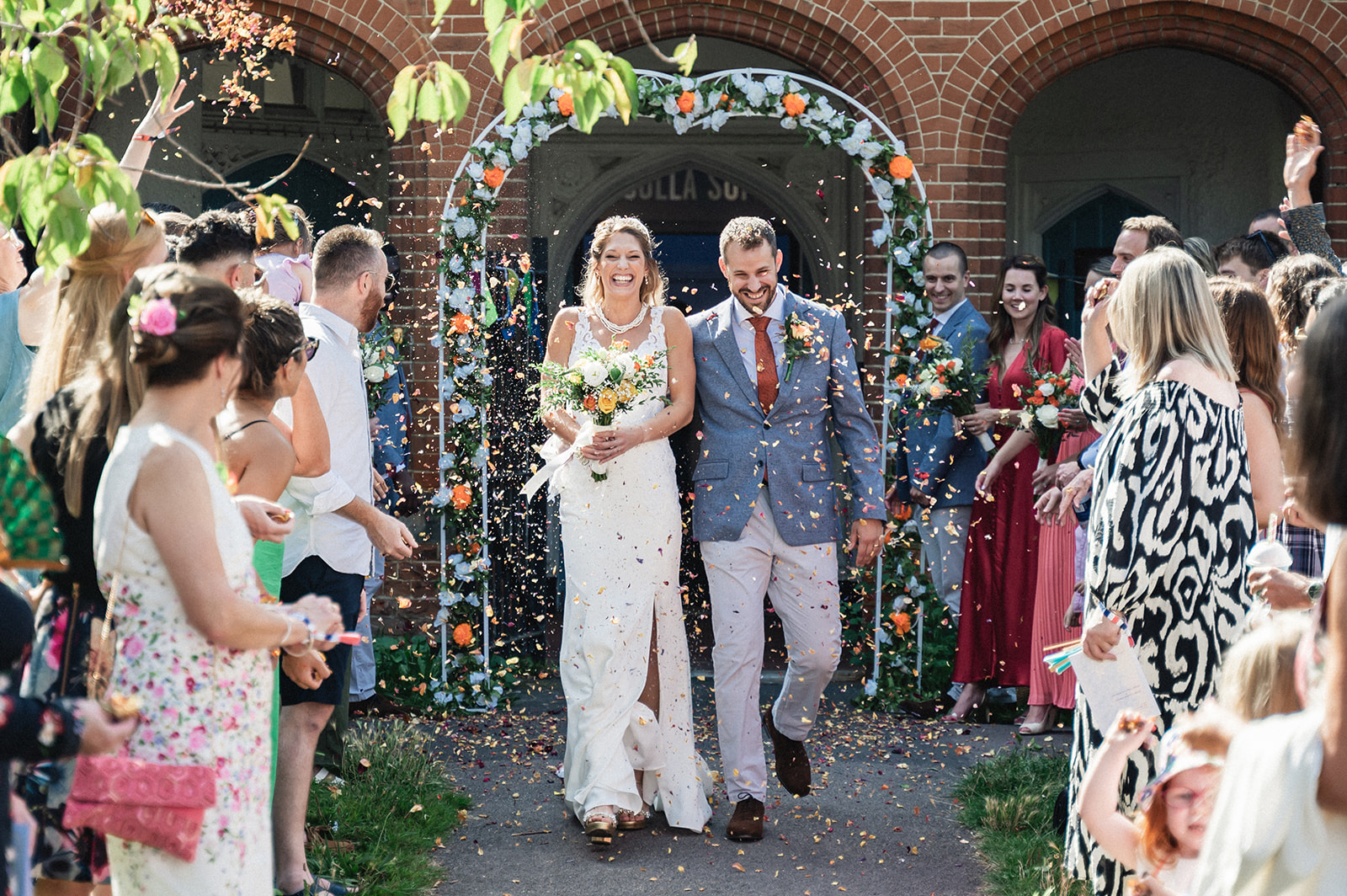 Natalie and George welcomed with confetti toss at Ashburton Hall