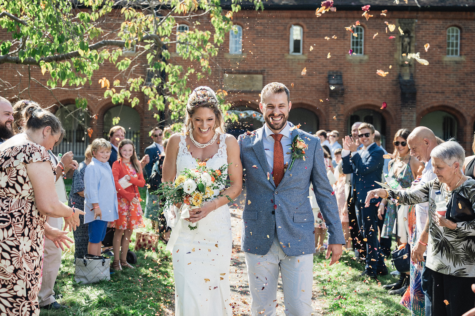 Natalie and George welcomed with confetti toss at Ashburton Hall