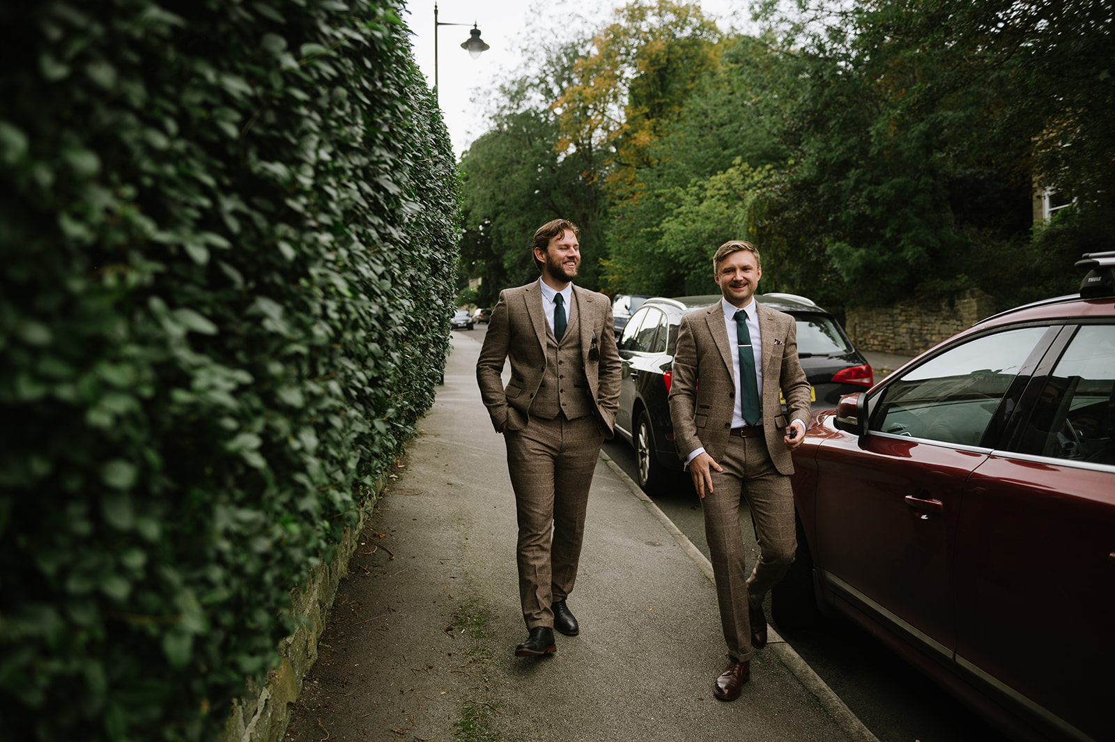 groom and best man walking down the road to his Whirlowbrook Hall wedding Sheffield