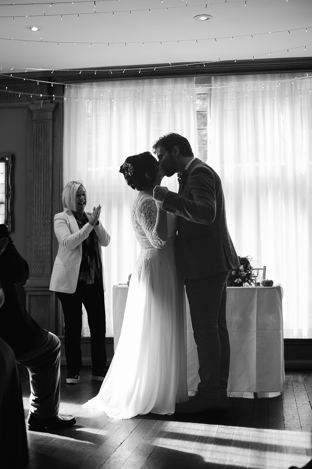 The bride and groom's first kiss in their wedding ceremony at Whirlowbrook Hall wedding in Sheffield.