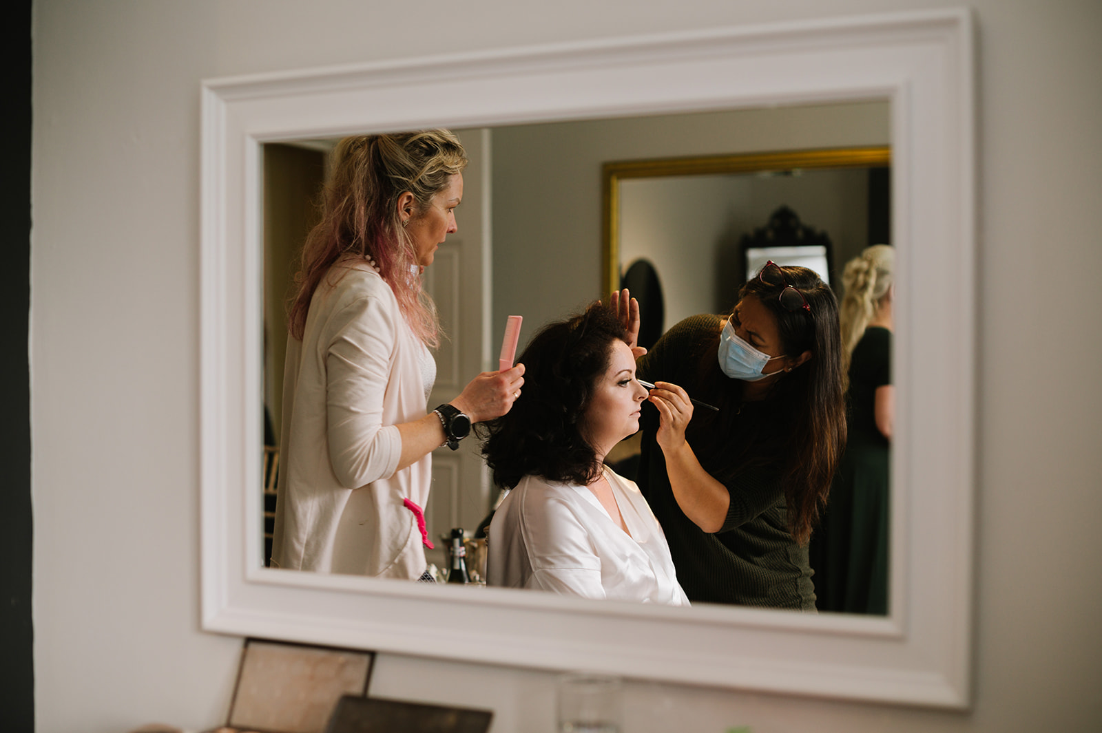 The Bride in hair and makeup for her Whirlowbrook Hall wedding in Sheffield.