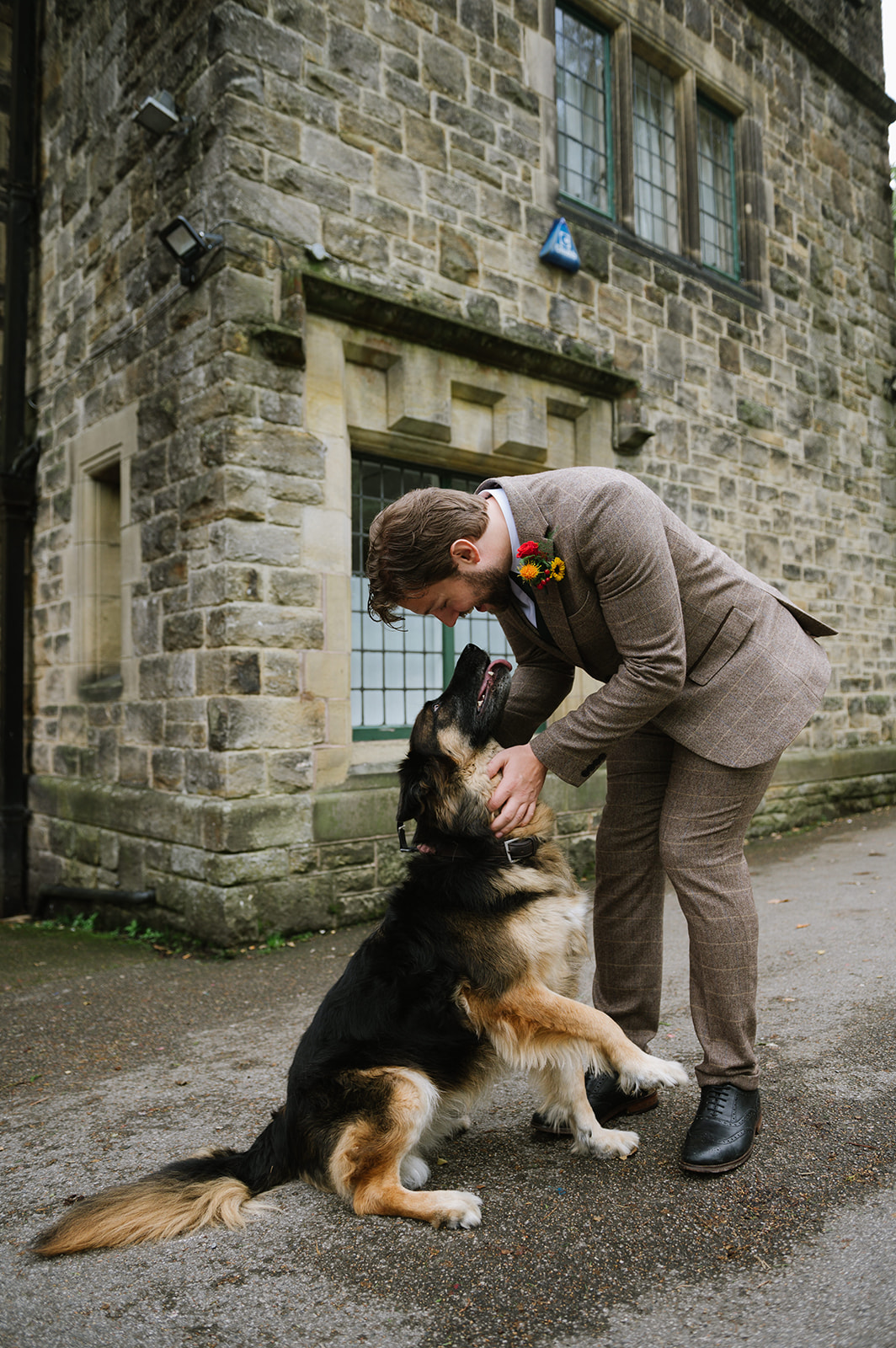 The groom and his dog at this Whirlowbrook Hall wedding in Sheffield
