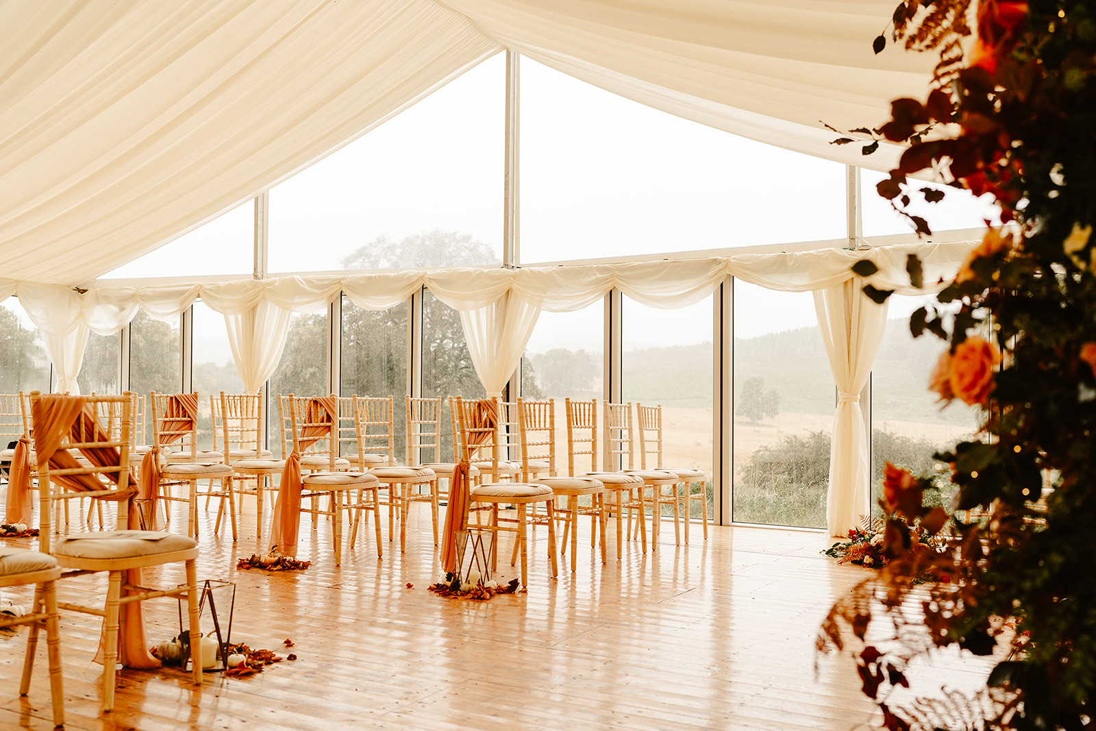 wedding ceremony set up at ballogie house chairs sit in a marquee