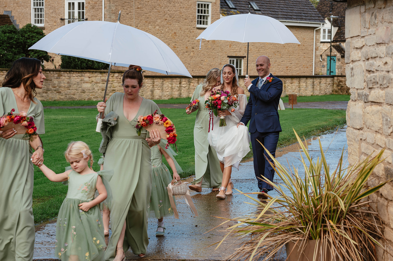 bridal party umbrellas rain Saxon Barn Leonard Stanley Cotswolds Gloucestershire Cheltenham Bristol Bath 