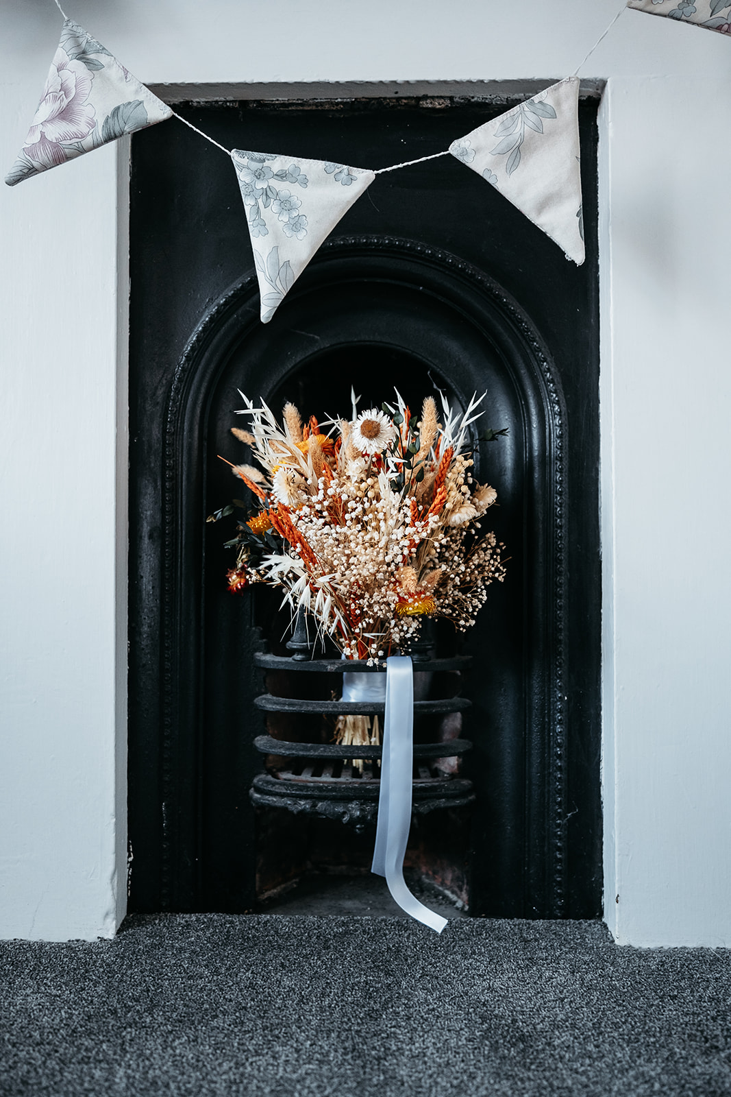 wedding flowers placed in a fire place