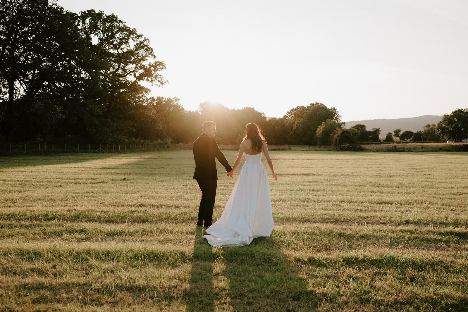 bride and groom at golden hour at barns and yard