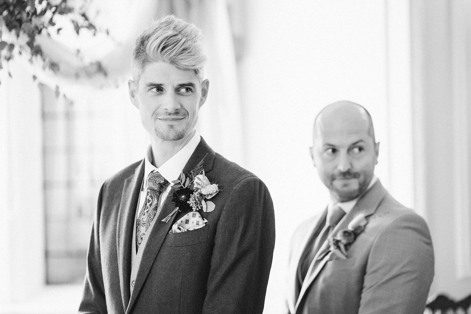 black and white photo of the groom and best man 