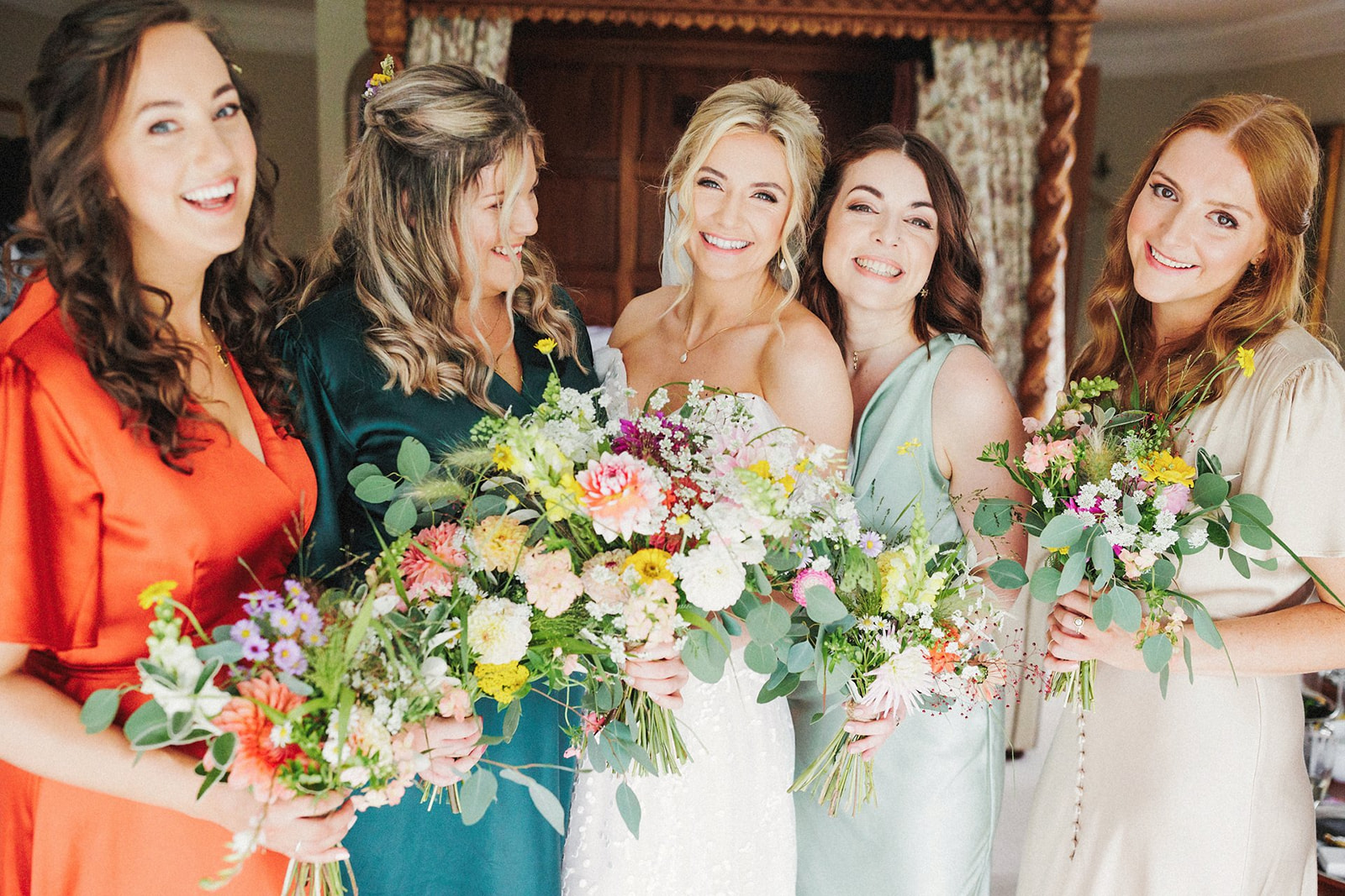 bridesmaids and bride with boquets
