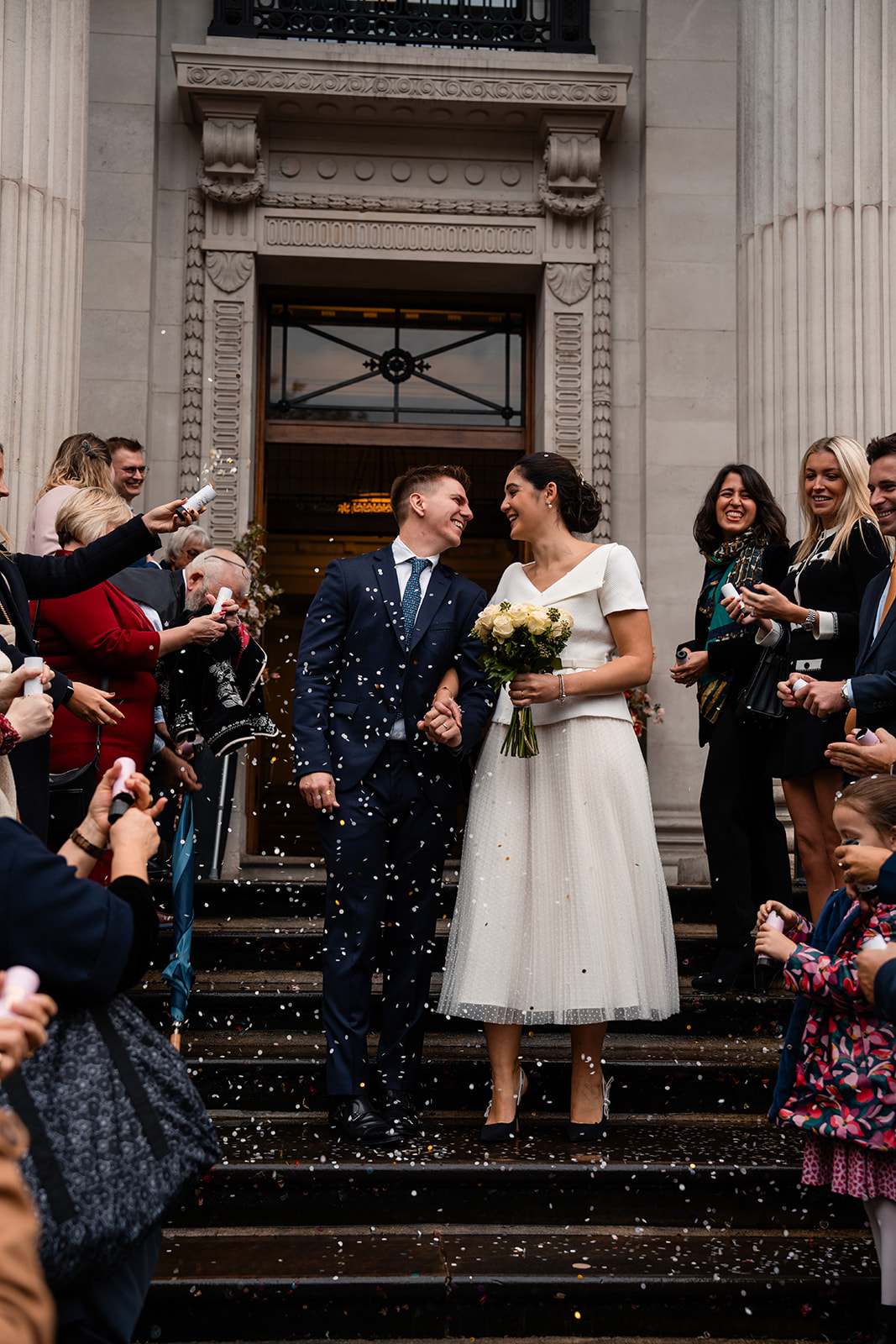 bride and groom and confetti at Marylebone old town hall