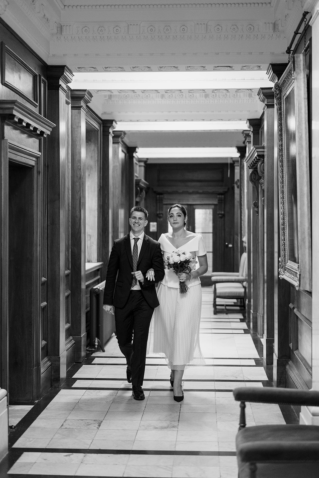 bride and groom in corridor of Marylebone old town hall