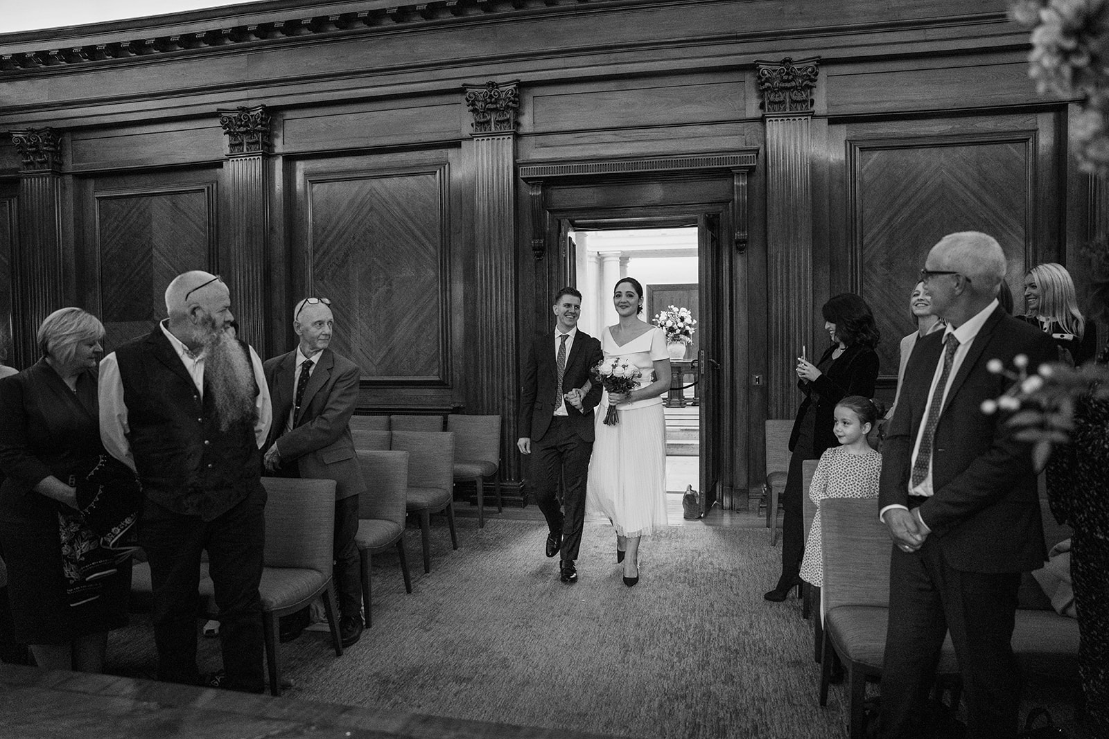 bride and groom entering ceremony room at Marylebone old town hall