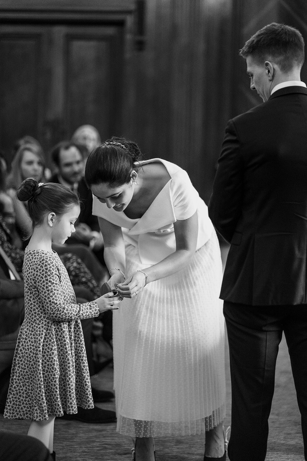flower girl giving wedding ring at Marylebone old town hall