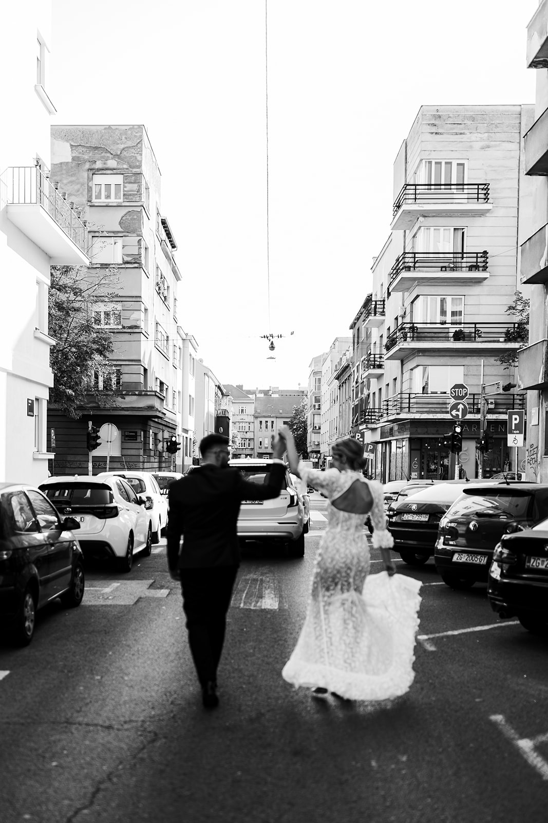 Couple walking trough Zagreb envy room dress
