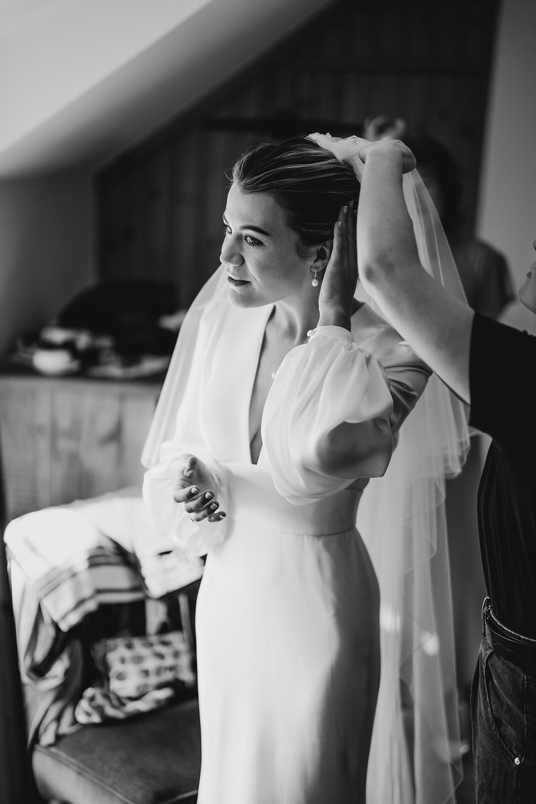 bride looking at herself in a mirror