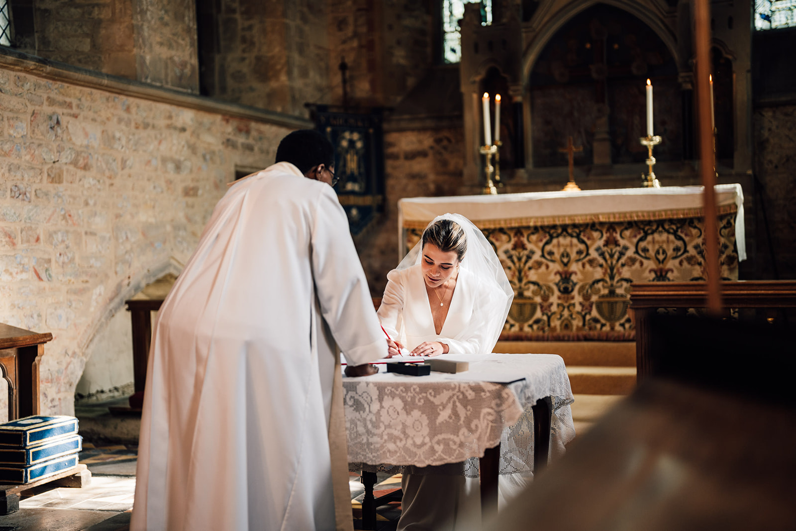 Bride signing the wedding register