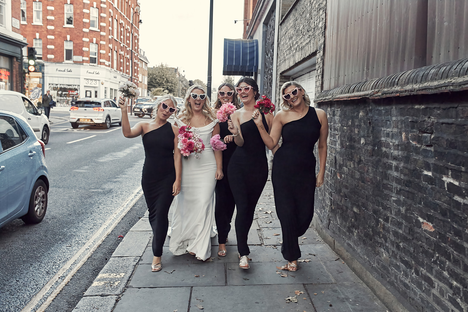 cute candid portrait of Katy and bride's maids on the streets of London
