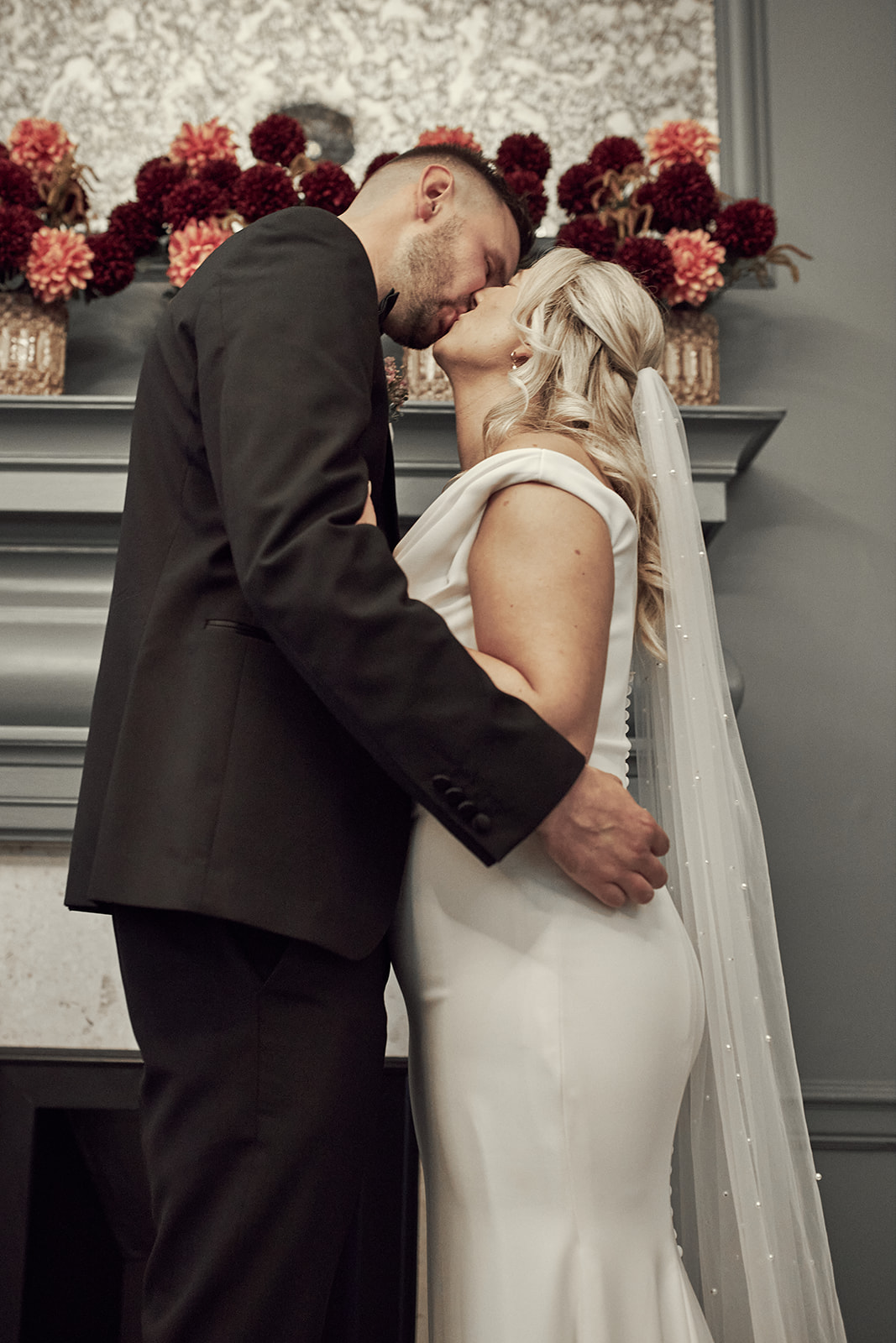 Katy and Max share kiss during the wedding ceremony in the Soho Room at Marylebone Town Hall