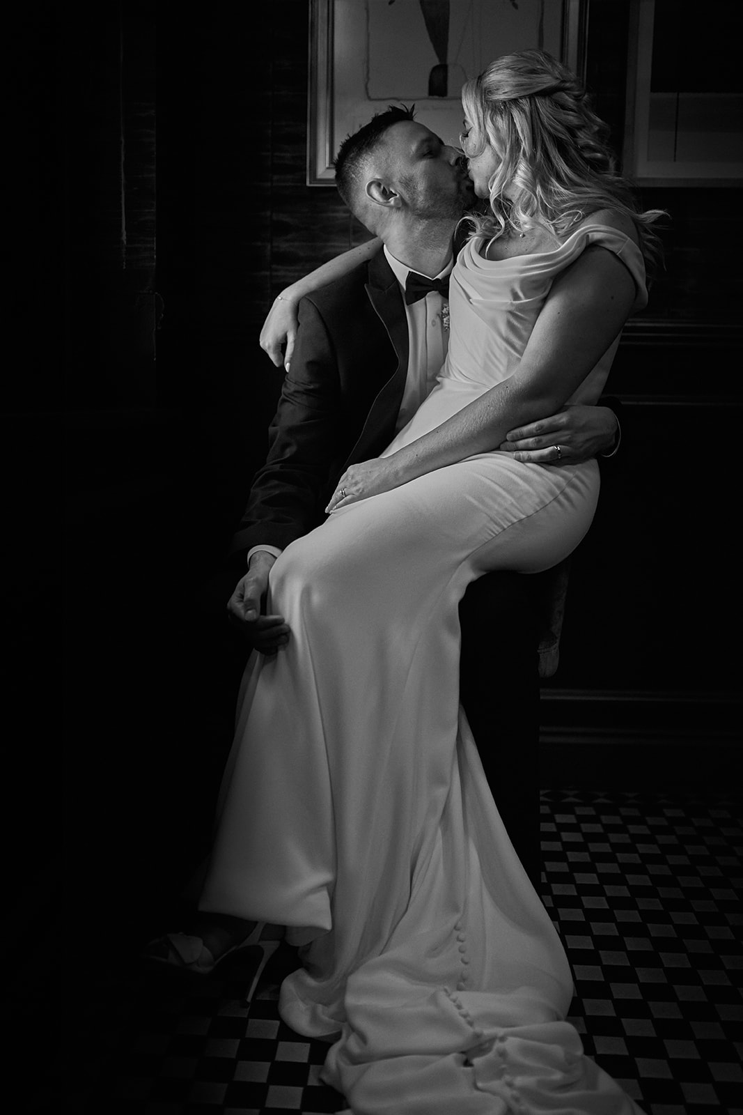 romantic portrait of Katy and Max kissing at Marylebone Town Hall