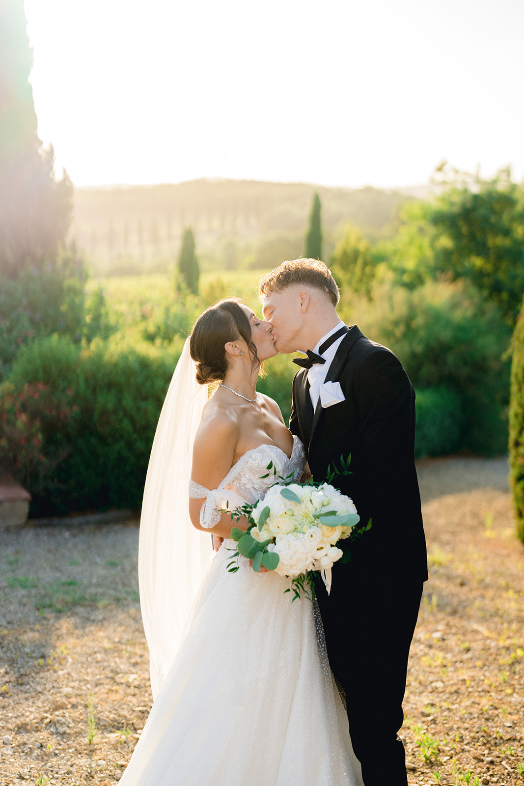 A kiss from the newlyweds under the Tuscan sunset