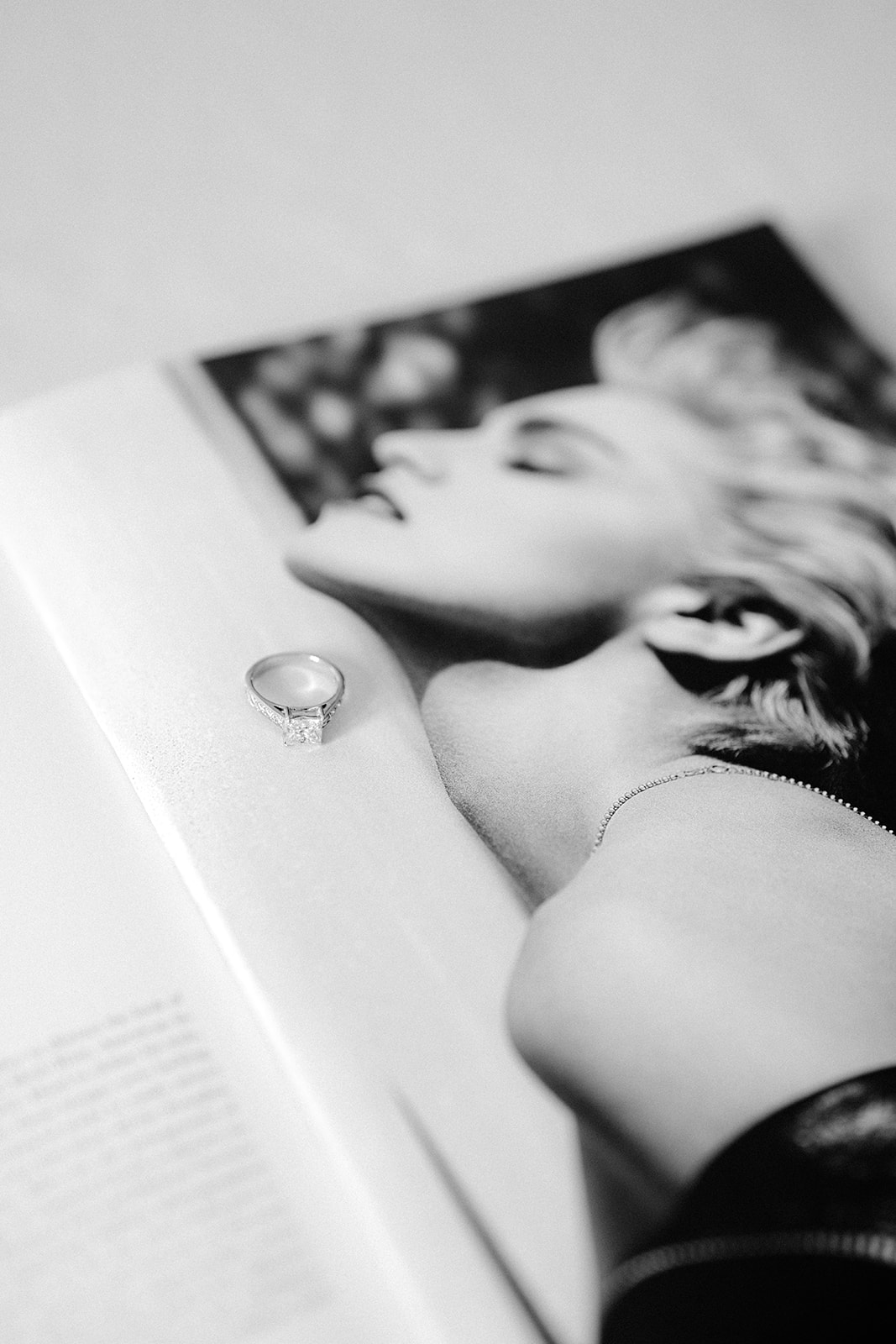 The engagement ring of the bride on a Marylin Monroe magazine