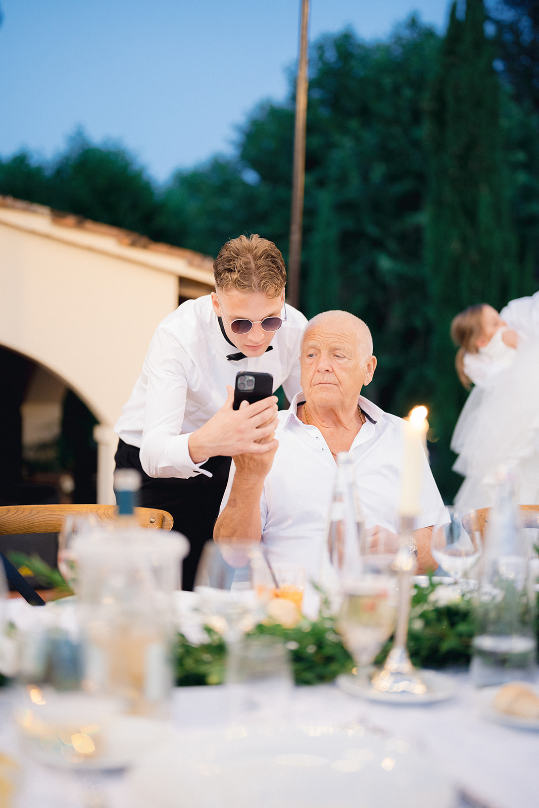 The groom joking around with his grandfather