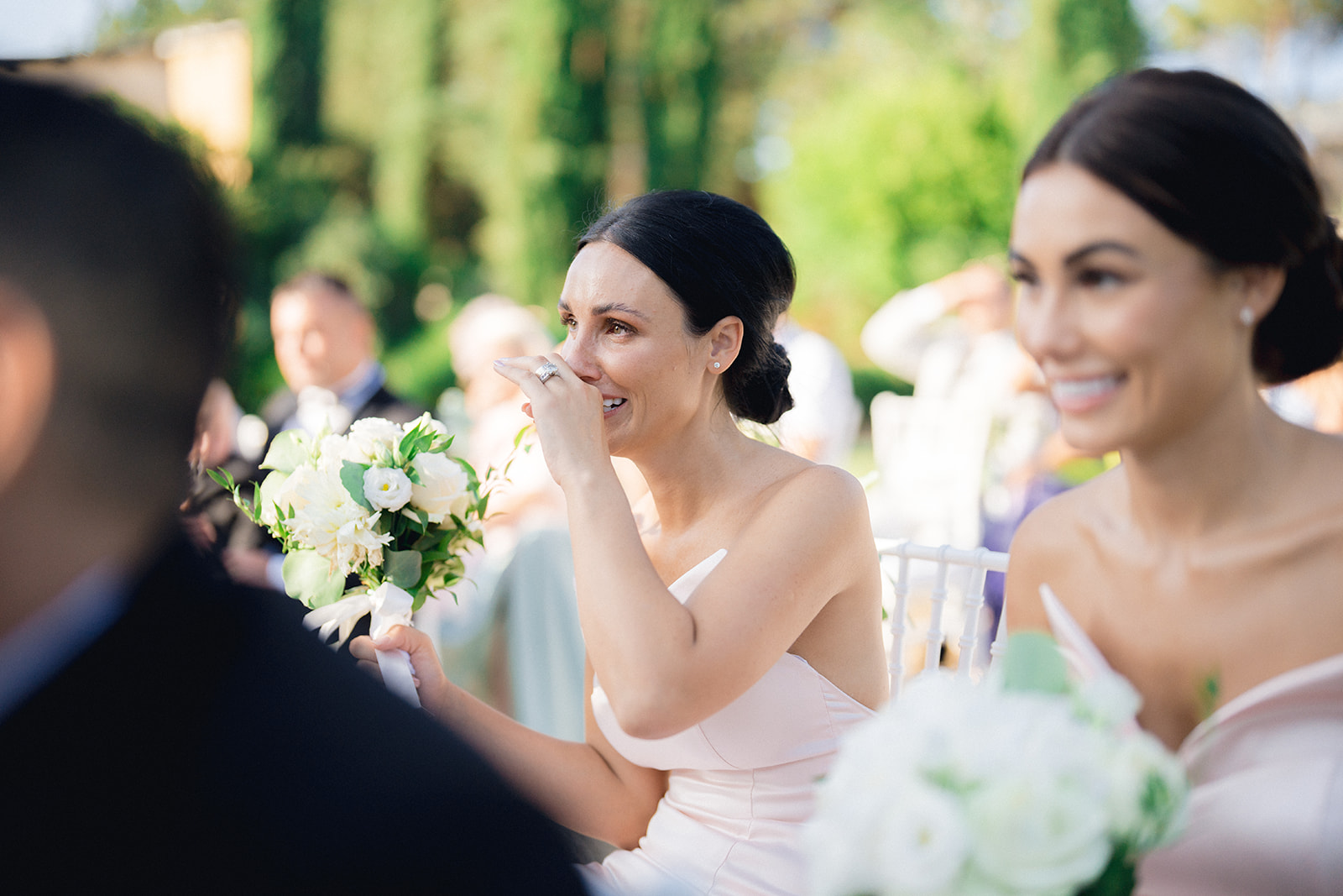 The sister of the bride is moved and in tears at her sister's wedding in Tuscany.