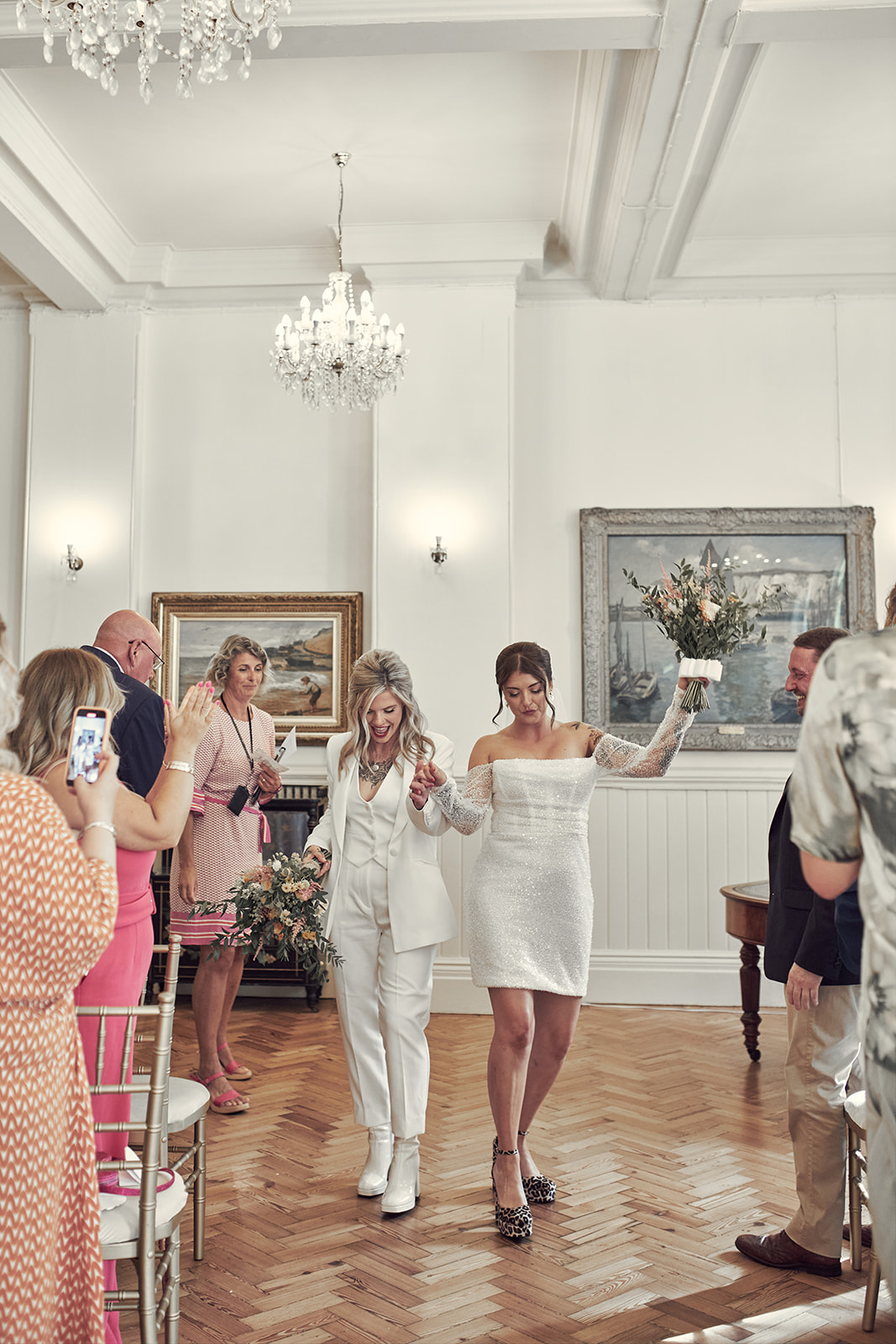 brides dancing their way out the room