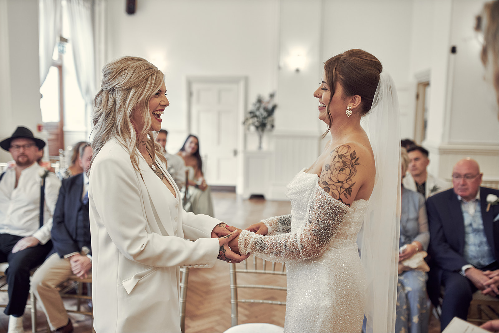brides holding each other's hands