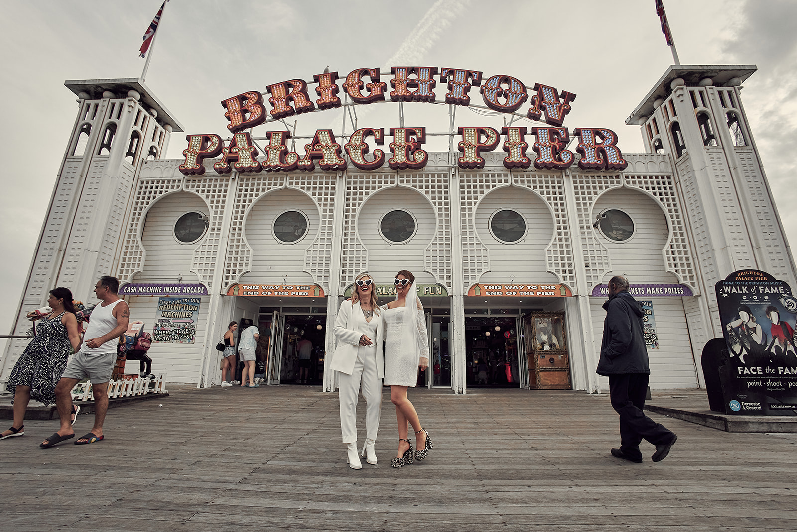 brides poses in brighton palace pier