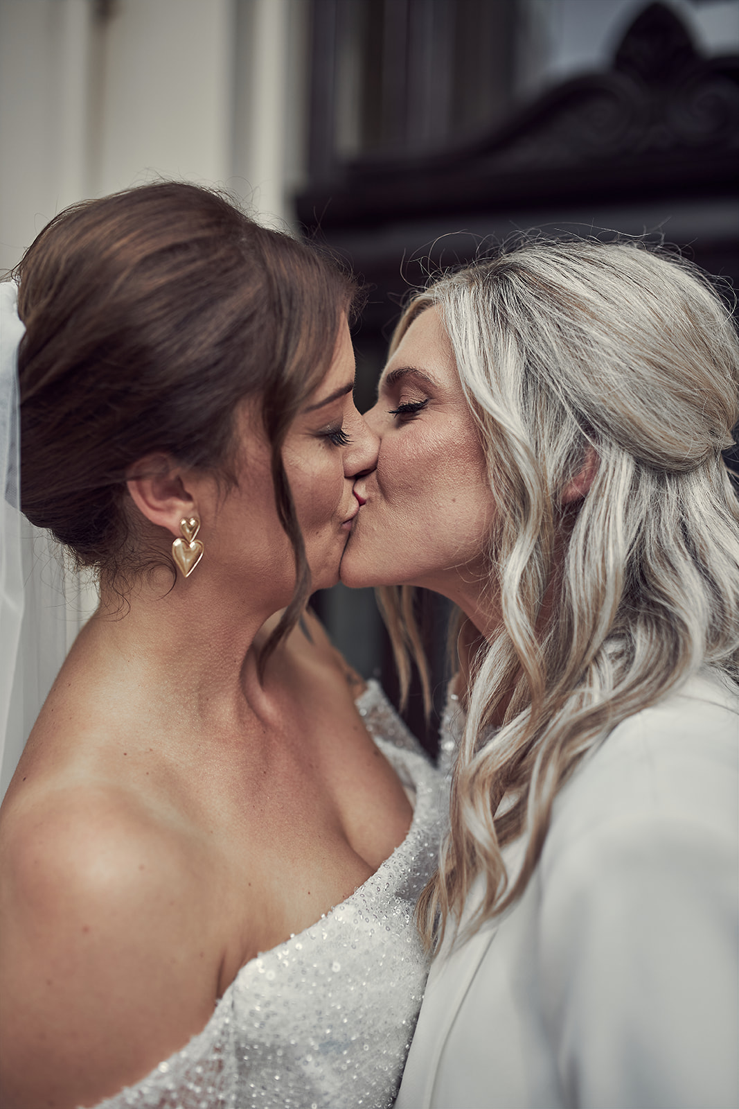 brides sharing a passionate kiss